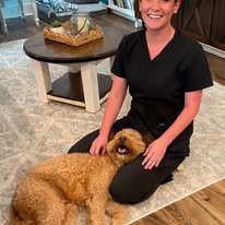 Sarah on floor with dog